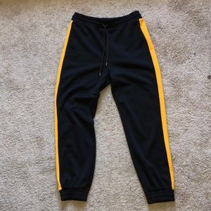 High waisted black+ yellow sweat pants/ joggers.